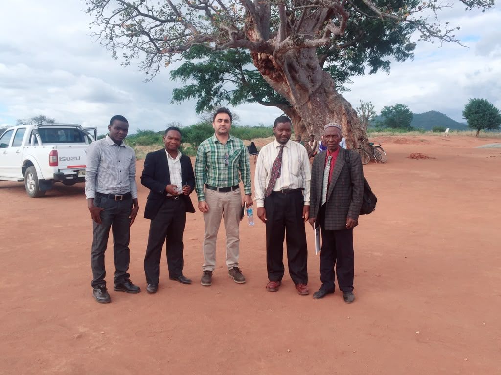 PMEye consultant with district officials and community representatives during a stakeholder engagement visit in Malawi