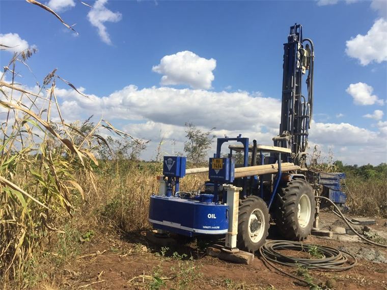 Borehole drilling rig at a rural water point installation site in Malawi